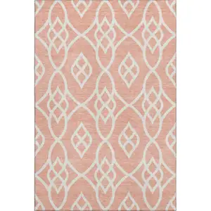 Photo of Salmon And Ivory Trellis Washable Area Rug With UV Protection