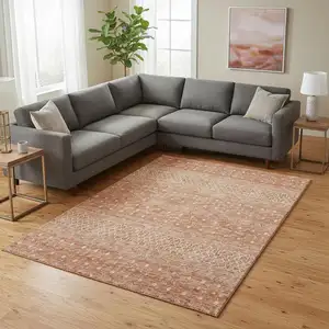 Photo of Salmon And Ivory Tribal Washable Area Rug With UV Protection