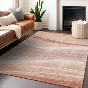 Photo of Salmon And Pink Abstract Washable Indoor Outdoor Area Rug