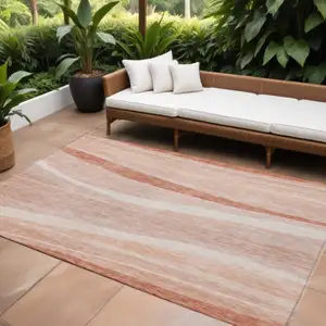 Photo of Salmon And Pink Abstract Washable Indoor Outdoor Area Rug