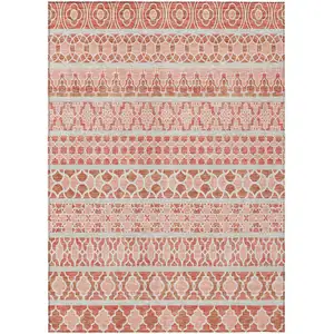 Photo of Salmon Beige And Copper Quatrefoil Washable Indoor Outdoor Area Rug