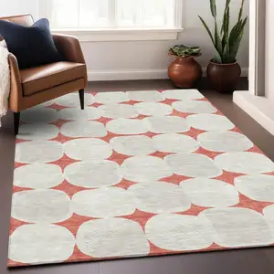 Photo of Salmon Beige And Ivory Abstract Washable Indoor Outdoor Area Rug