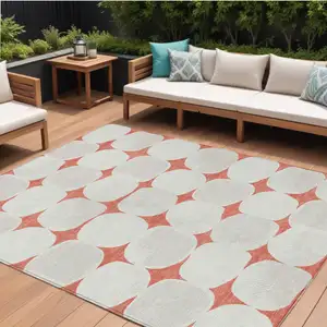 Photo of Salmon Beige And Ivory Abstract Washable Indoor Outdoor Area Rug