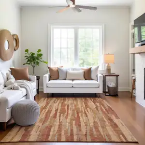 Photo of Salmon Brick Red And Gold Striped Washable Area Rug With UV Protection