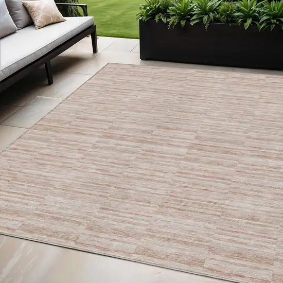 Salmon Copper And Beige Striped Washable Indoor Outdoor Area Rug Photo 1