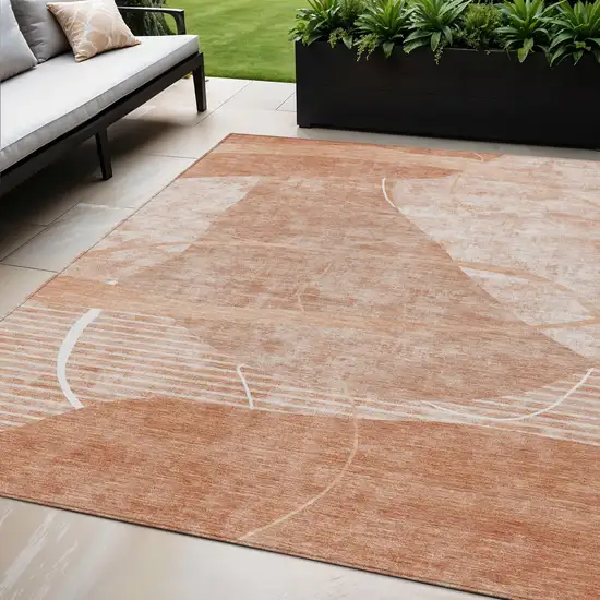Salmon Copper And Ivory Abstract Washable Indoor Outdoor Area Rug Photo 1