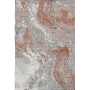 Photo of Salmon Gray And Ivory Abstract Washable Area Rug With UV Protection
