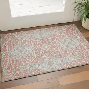 Photo of Salmon Gray And Ivory Floral Washable Area Rug With UV Protection