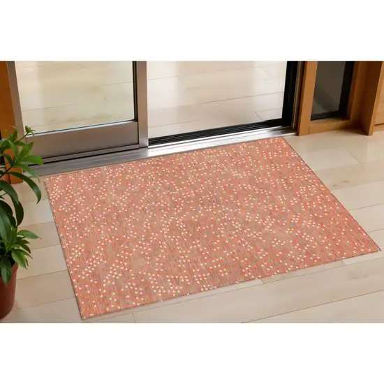 Salmon Gray And Ivory Polka Dot Washable Indoor Outdoor Area Rug Photo 1