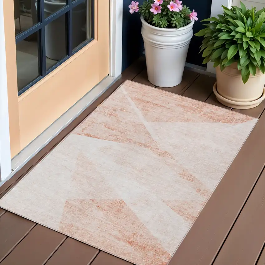 Salmon Peach And Ivory Abstract Washable Indoor Outdoor Area Rug Photo 1