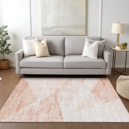 Salmon Peach And Ivory Abstract Washable Indoor Outdoor Area Rug Photo 9