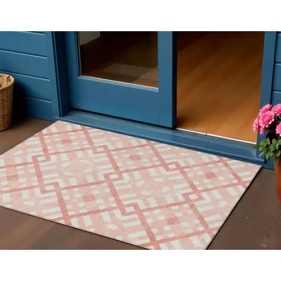 Salmon Peach And Ivory Geometric Washable Indoor Outdoor Area Rug Photo 1