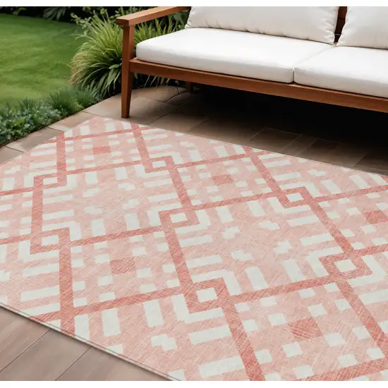 Salmon Peach And Ivory Geometric Washable Indoor Outdoor Area Rug Photo 1