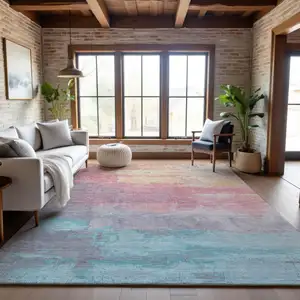 Photo of Salmon Silver And Teal Abstract Washable Area Rug With UV Protection