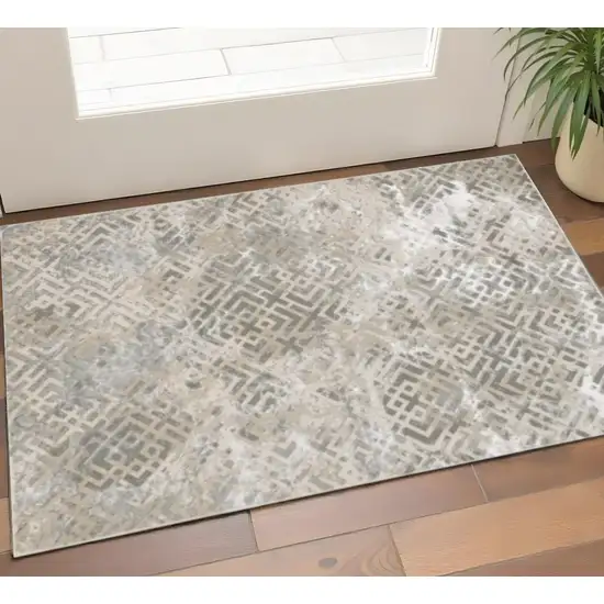 Sand And Light Blue Geometric Distressed Area Rug Photo 1