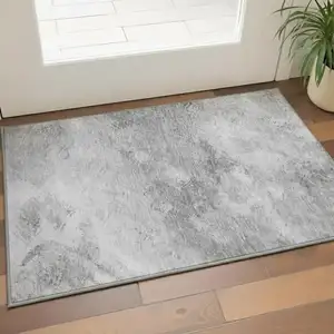 Photo of Silver And Gray Abstract Washable Area Rug With UV Protection