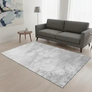Photo of Silver And Gray Abstract Washable Area Rug With UV Protection