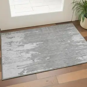 Photo of Silver And Gray Abstract Washable Area Rug With UV Protection