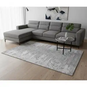 Photo of Silver And Gray Abstract Washable Area Rug With UV Protection