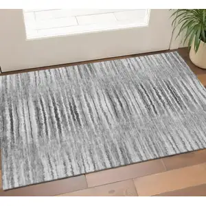 Photo of Silver And Gray Striped Washable Area Rug With UV Protection