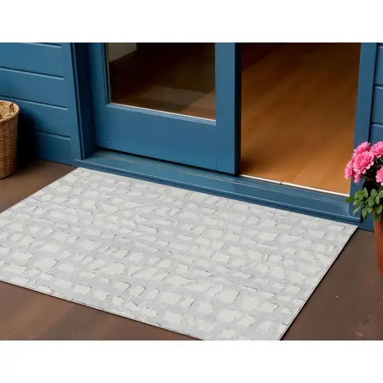 Silver And Ivory Abstract Washable Indoor Outdoor Area Rug Photo 1