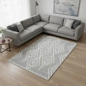 Photo of Silver And Ivory Geometric Washable Area Rug With UV Protection