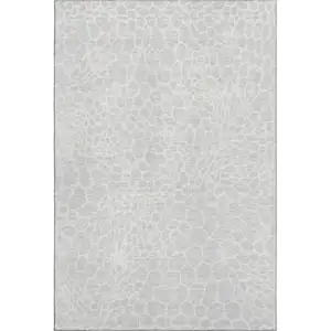 Photo of Silver And Ivory Geometric Washable Area Rug With UV Protection