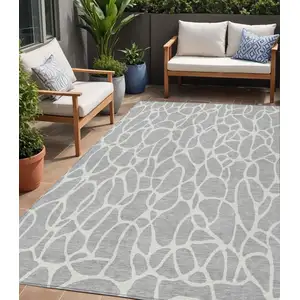 Photo of Silver And Ivory Geometric Washable Indoor Outdoor Area Rug