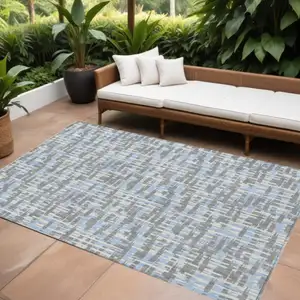 Photo of Silver Blue And Beige Abstract Washable Indoor Outdoor Area Rug
