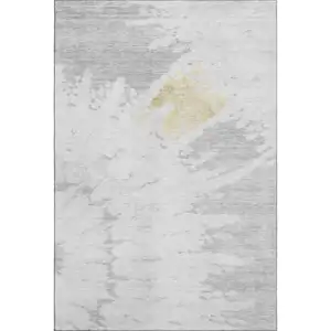 Photo of Silver Gold And Ivory Abstract Washable Area Rug With UV Protection