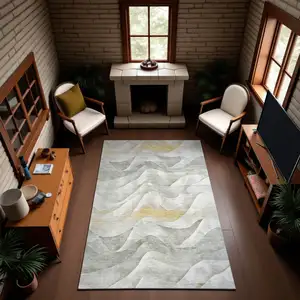 Photo of Silver Gold And Ivory Abstract Washable Area Rug With UV Protection