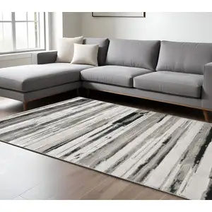 Photo of Silver Gray And Black Abstract Stain Resistant Area Rug