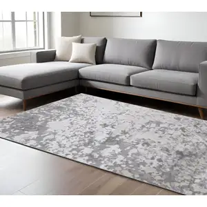 Photo of Silver Gray And White Abstract Stain Resistant Area Rug