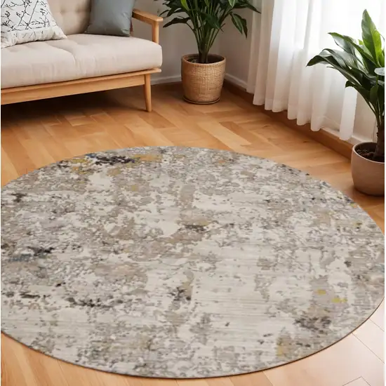 8' Beige Tan And Gold Abstract Round Rug Photo 1