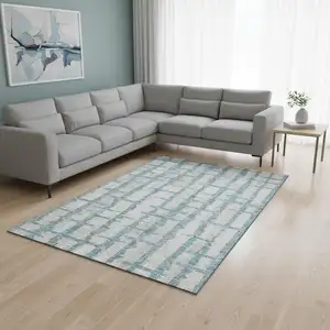 Photo of Sky Blue And Beige Striped Washable Area Rug With UV Protection