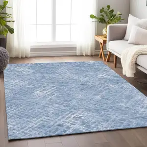 Photo of Sky Blue And Ivory Abstract Geometric Washable Area Rug With UV Protection