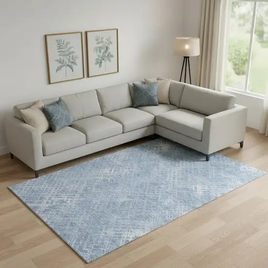 Sky Blue And Ivory Abstract Geometric Washable Area Rug With UV Protection Photo 1