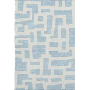 Photo of Sky Blue And Ivory Abstract Geometric Washable Area Rug With UV Protection