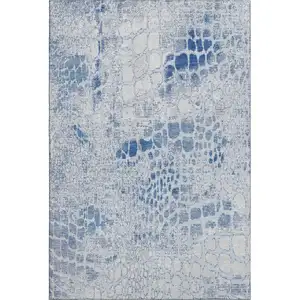 Photo of Sky Blue And Ivory Abstract Geometric Washable Area Rug With UV Protection