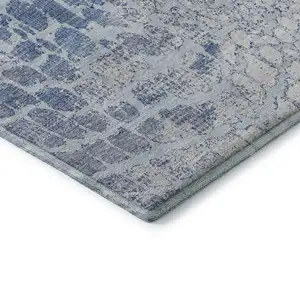 Photo of Sky Blue And Ivory Abstract Geometric Washable Area Rug With UV Protection