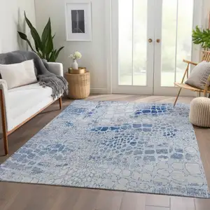 Photo of Sky Blue And Ivory Abstract Geometric Washable Area Rug With UV Protection
