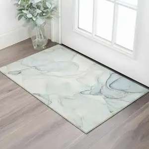 Photo of Sky Blue And Ivory Abstract Washable Area Rug With UV Protection