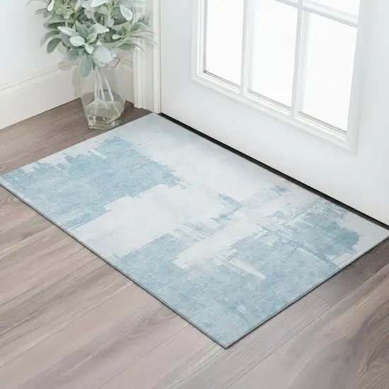 Sky Blue And Ivory Abstract Washable Area Rug With UV Protection Photo 1