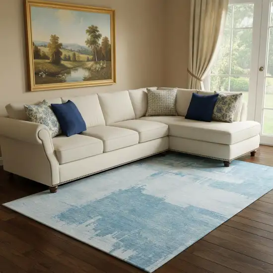 Sky Blue And Ivory Abstract Washable Area Rug With UV Protection Photo 1