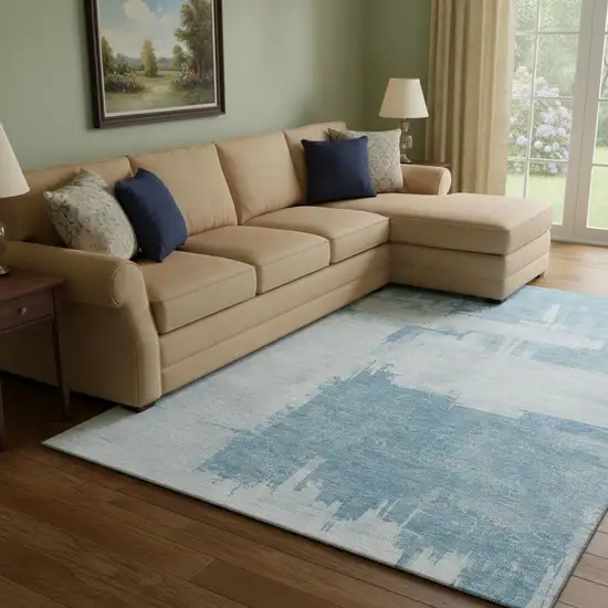 Sky Blue And Ivory Abstract Washable Area Rug With UV Protection Photo 1