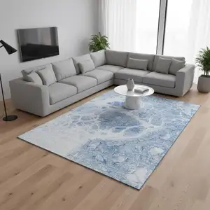 Photo of Sky Blue And Ivory Abstract Washable Area Rug With UV Protection