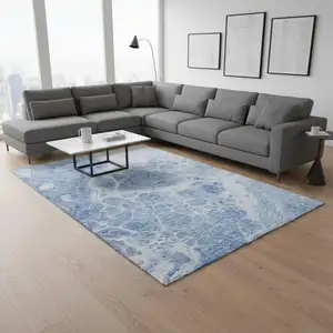 Photo of Sky Blue And Ivory Abstract Washable Area Rug With UV Protection