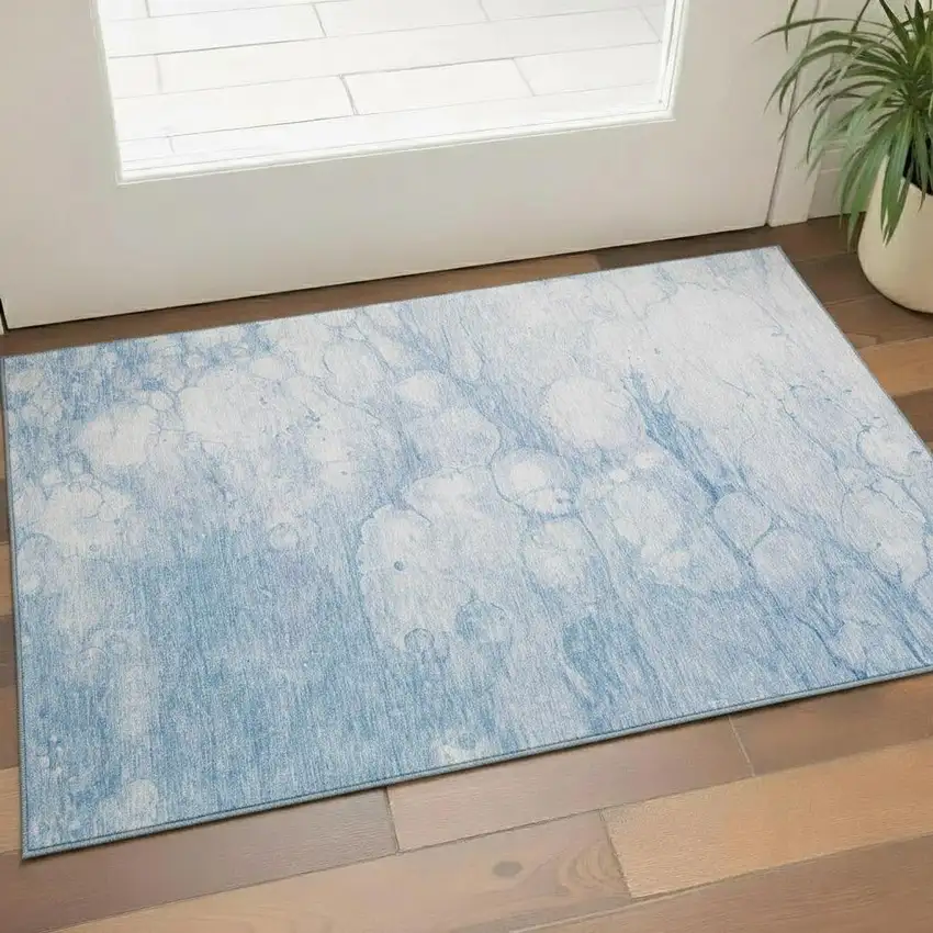 Sky Blue And Ivory Abstract Washable Area Rug With UV Protection Photo 1