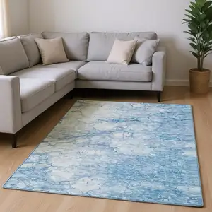 Photo of Sky Blue And Ivory Abstract Washable Area Rug With UV Protection