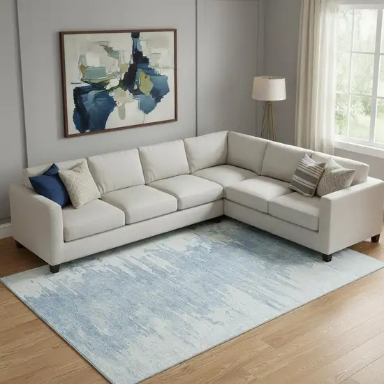 Sky Blue And Ivory Abstract Washable Area Rug With UV Protection Photo 1